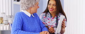 elderly woman and caregiver talking